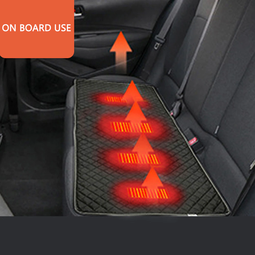 A heated seat in a car with a heated blanket to keep warm in winter